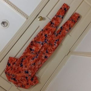 Orange jumpsuit with blue white and red